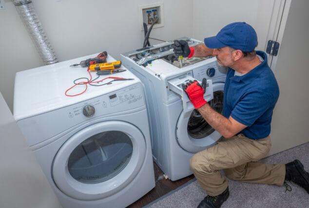 a repairman installing a new door seal on a fridge in Chenango Bridge